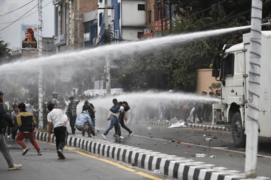 Police firing tear gas and water cannons at Gen-Z protesters in Kathmandu, Nepal, where six people have died and dozens are injured.