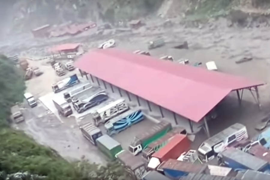 Severe flooding at the Nepal-China border in Rasuwagadhi washes away the Miteri Bridge, vehicles, and hydropower infrastructure.