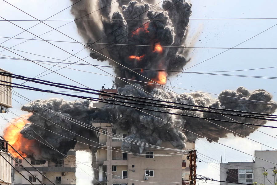 A fireball rises from a building hit by an Israeli airstrike in the area of Abbasiyeh, on the outskirts of the southern Lebanese city of Tyre.