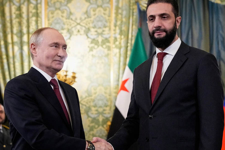 Ahmed al-Sharaa and Vladimir Putin meeting in the Kremlin to discuss Syria-Russia relations and the possible extradition of ex-president Bashar al-Assad.