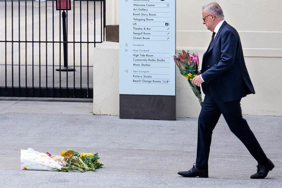 Anthony Albanese placing flowers at the Bondi Pavilion memorial site following the Bondi beach attack.