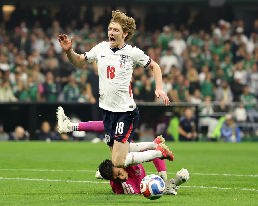 Anthony Gordon is brought down by Raul Rangel for England's penalty