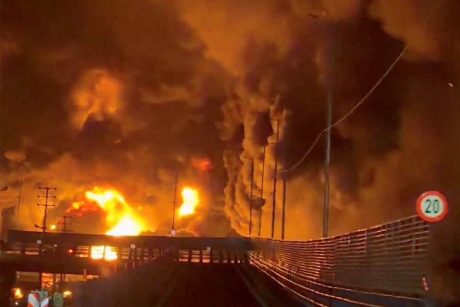 Large flames and heavy smoke billowing from the Aqdasieh oil depot in Tehran after an Israeli airstrike hit fuel storage tanks on 7 March 2026.