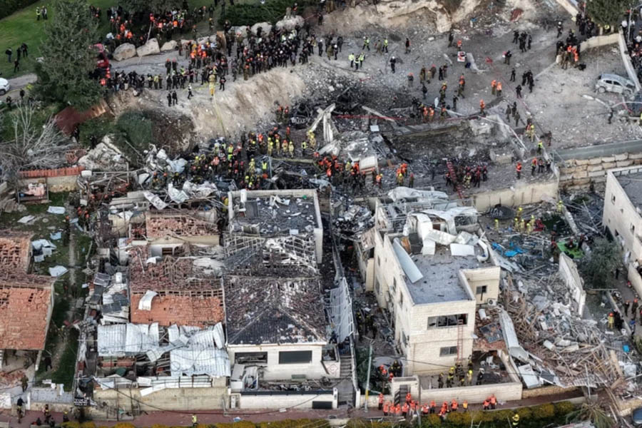 First responders from Magen David Adom providing emergency assistance at the site of an Iranian missile strike in Beit Shemesh, Israel, where nine fatalities were reported.