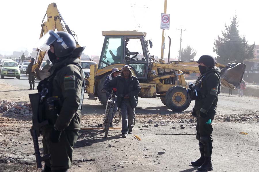 Police and military forces clear road blocks in El Alto. President Rodrigo Paz declared a 90-day state of emergency and deployed soldiers and bulldozers to end the crisis.