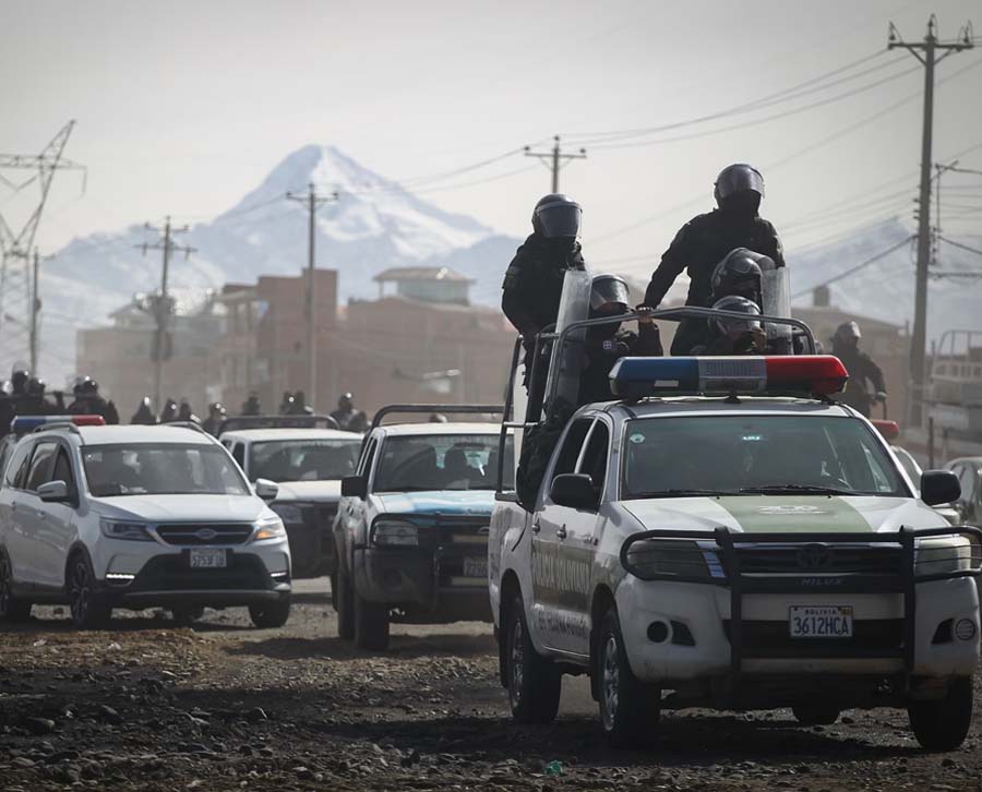 Security forces patrol a road in La Paz, Bolivia, after the government declared a state of emergency