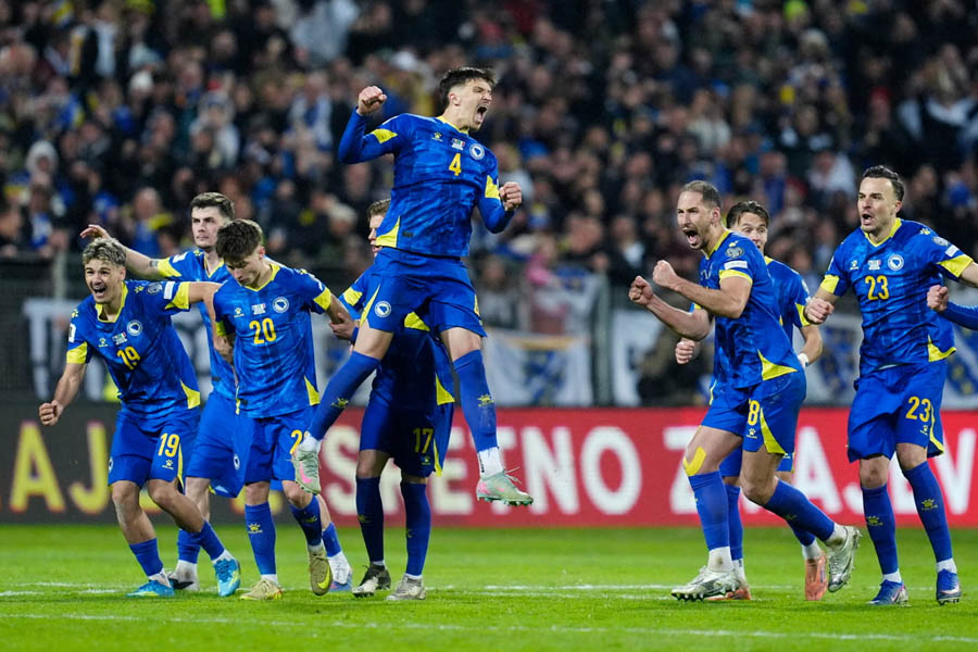 Bosnia and Herzegovina players celebrate with joy after securing victory in the penalty shootout and booking their place at the World Cup.