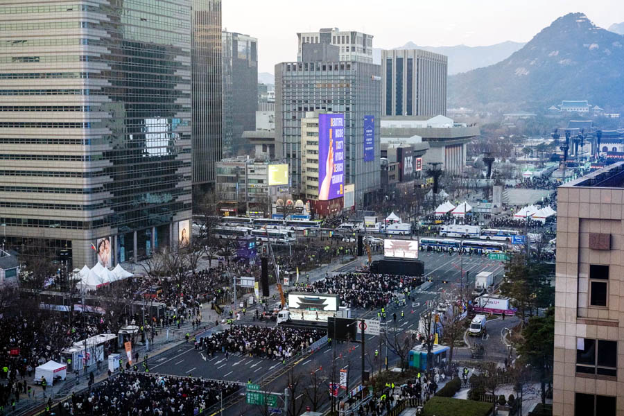 Crowds of fans with ARMY light sticks fill Gwanghwamun Square in Seoul, South Korea, for BTS’ highly anticipated comeback concert.