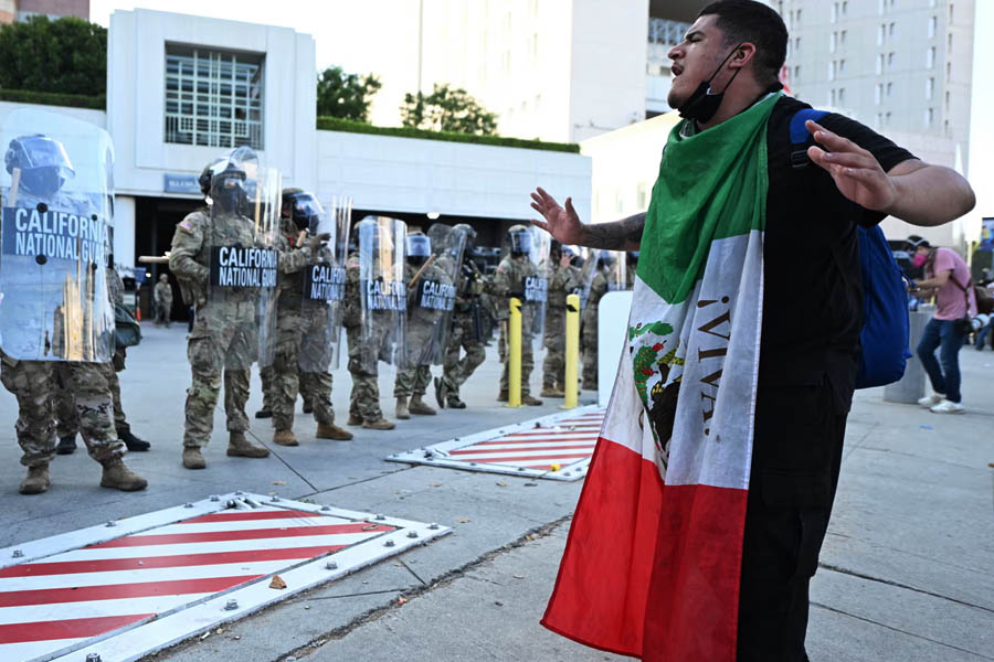 A demonstrator and members of the California national guard on Thursday in Los Angeles.