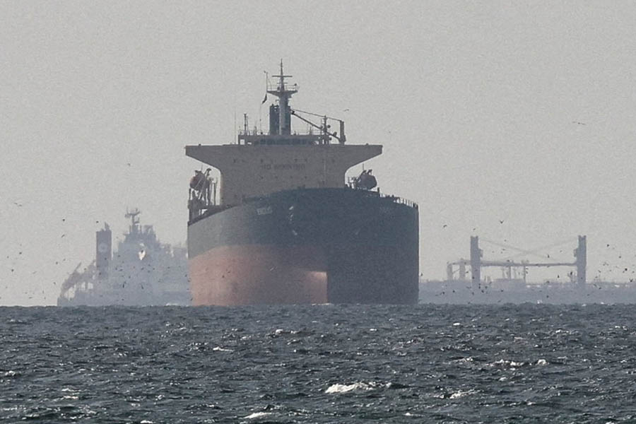 Cargo ships sailing in the Persian Gulf close to the Strait of Hormuz, showing maritime traffic and oil transport routes.