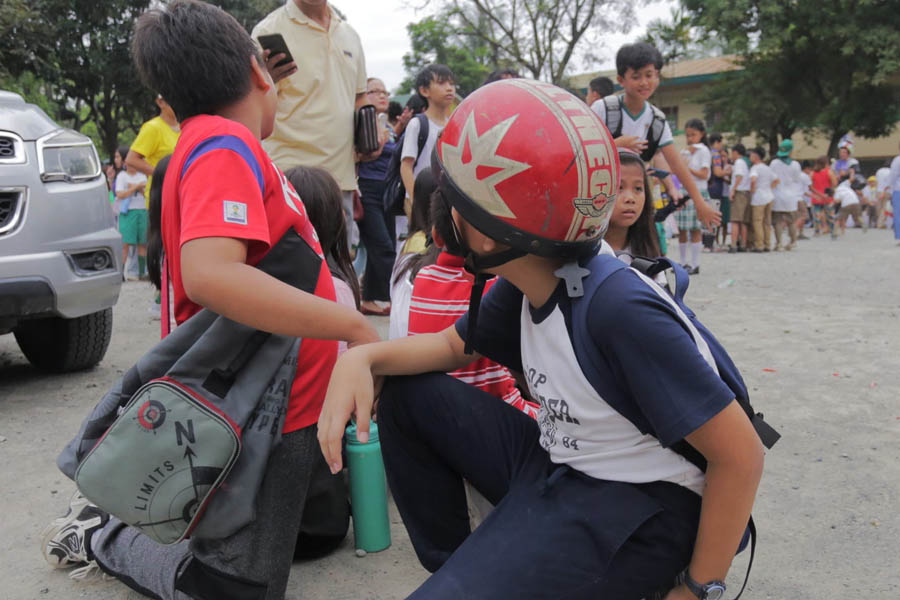 Schoolchildren in Davao City, Philippines, evacuate safely following a powerful 7.6-magnitude earthquake.