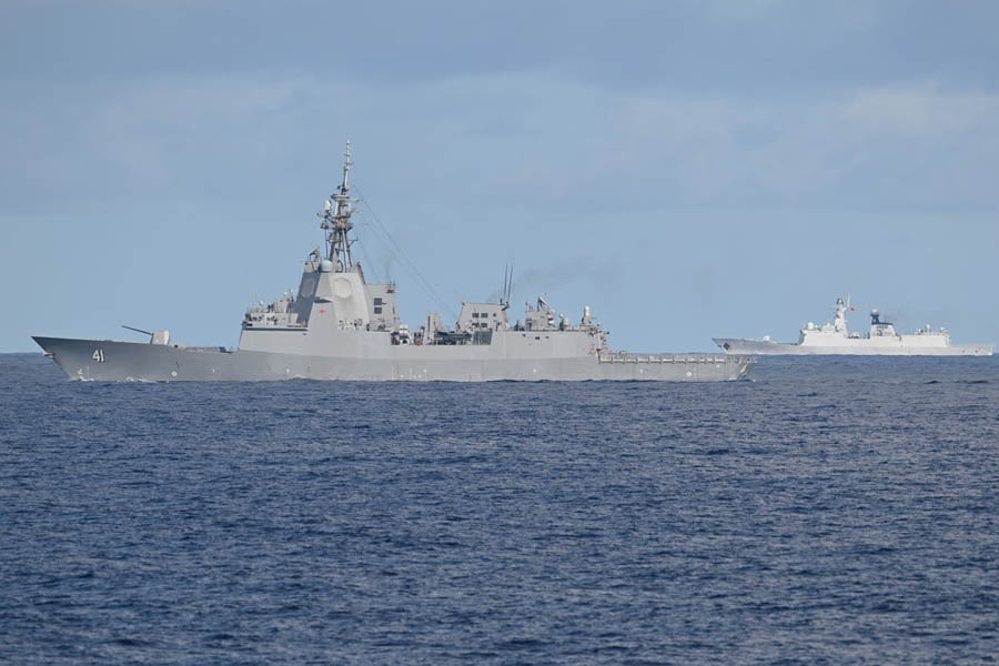 Chinese PLA Navy vessel following the Royal Australian Navy destroyer HMAS Brisbane during multinational naval operations with Canada and the Philippines in disputed South China Sea waters, September 2025.