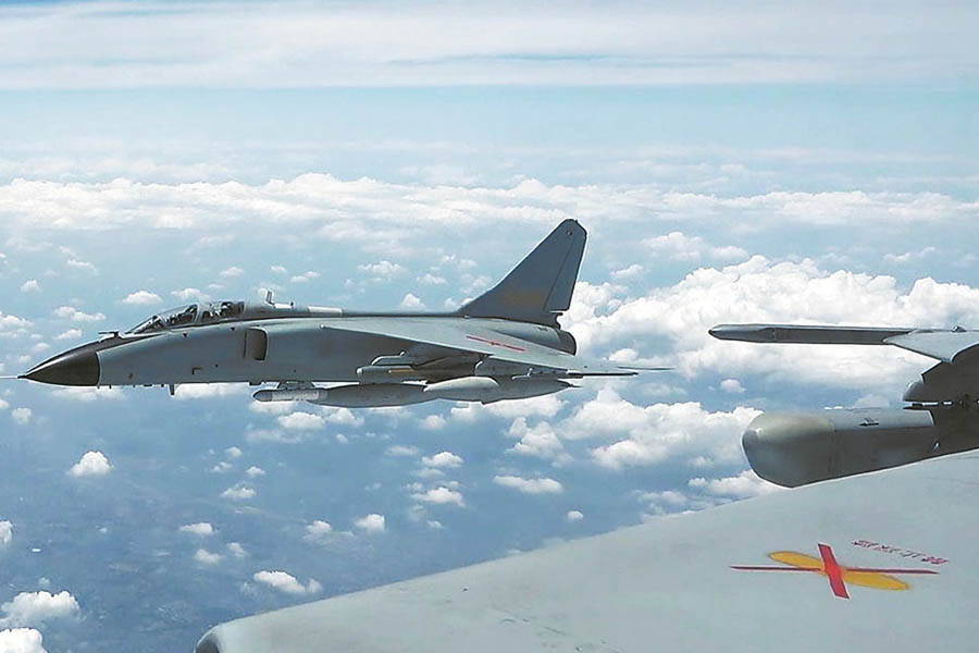 Chinese PLA military aircraft conducting live-fire exercises around Taiwan as naval, air force, and rocket forces surround the island