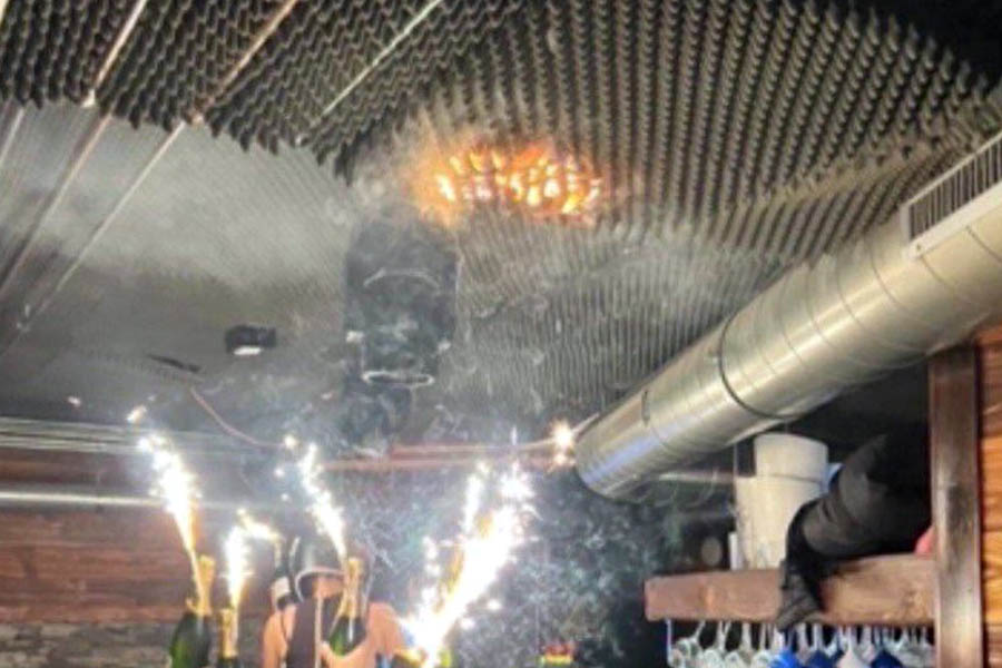 Ceiling catching fire inside Le Constellation nightclub in Crans-Montana, Switzerland, after champagne sparklers ignited flammable ceiling materials during New Year celebrations.