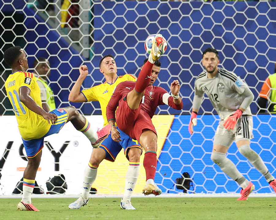 Cristiano Ronaldo attempts an overhead kick during a hugely entertaining first half against Colombia