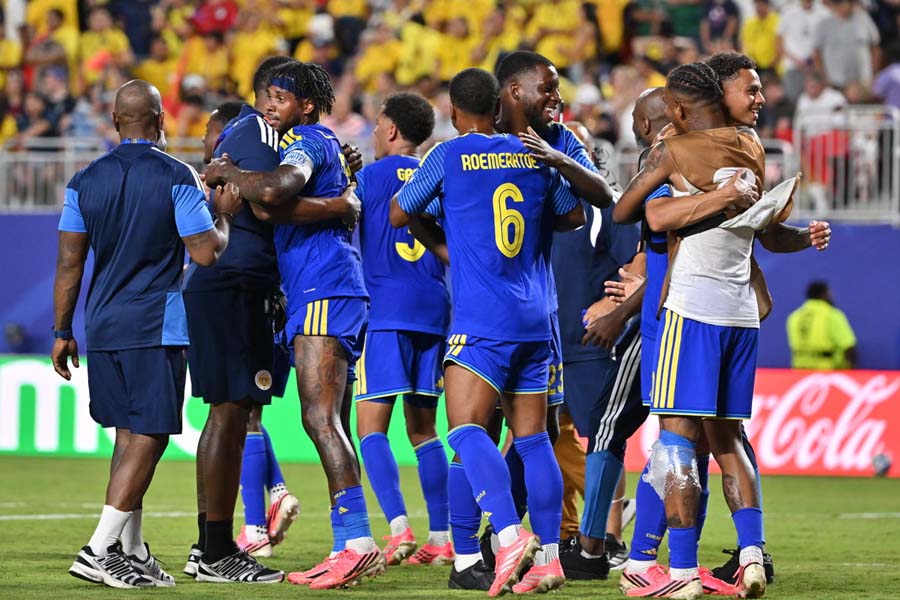 Players of Curaçao embrace after claiming a famous point. The smallest nation ever to qualify for a World Cup secured their first-ever point with a heroic 0-0 draw against Ecuador.