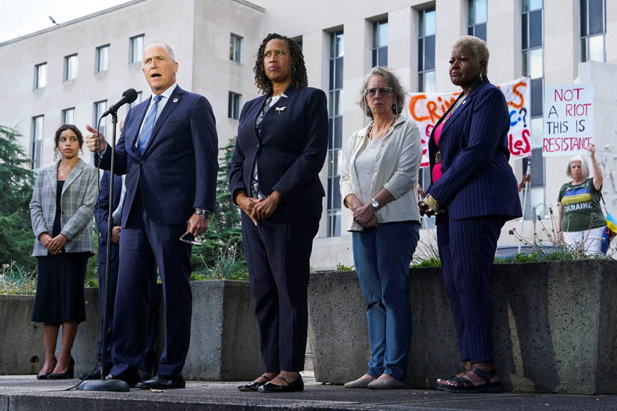 DC Attorney General Brian Schwalb and Mayor Muriel Bowser address the press after a court session, pushing back against the Trump administration’s attempted takeover of the city’s police department.