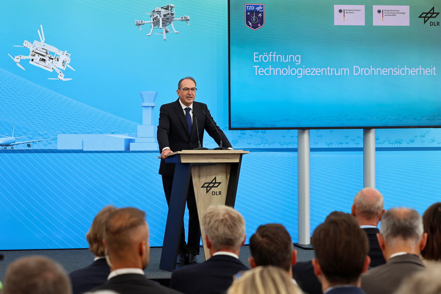 German interior minister Alexander Dobrindt speaks at the opening of a facility for drone security to explore the protection of critical infrastructure at the airfield of Cochstedt, Germany.
