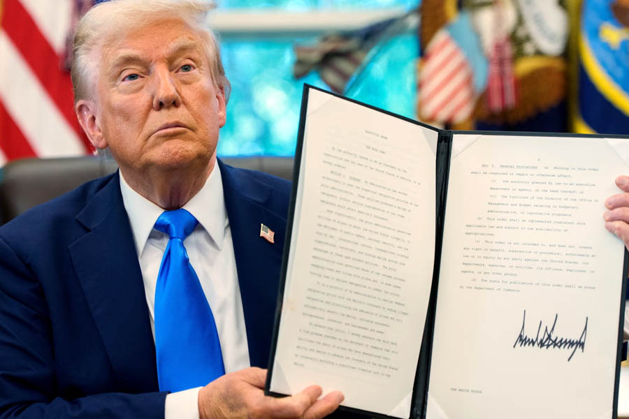 Donald Trump with H-1B visa proclamation in the Oval Office, White House, Washington DC.
