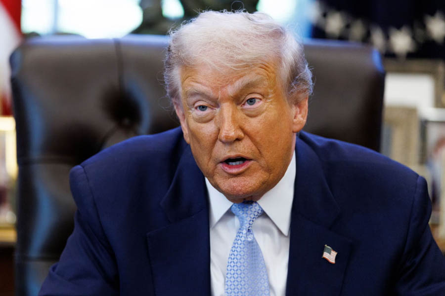 Donald Trump seated in the Oval Office on Monday, ahead of signing legislation requiring the release of Epstein-related documents.