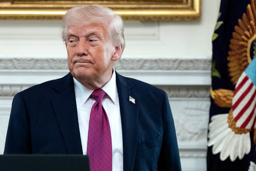 Donald Trump departs after speaking at an event for NCAA national champions in the State Dining Room of the White House on Tuesday.