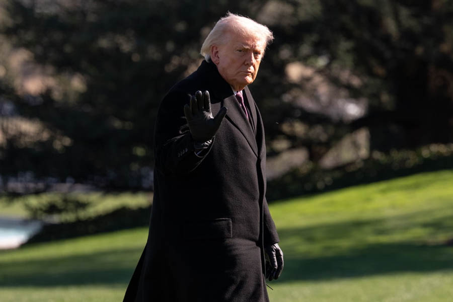 President Donald J Trump waving while arriving at the White House in Washington DC, USA, with official setting