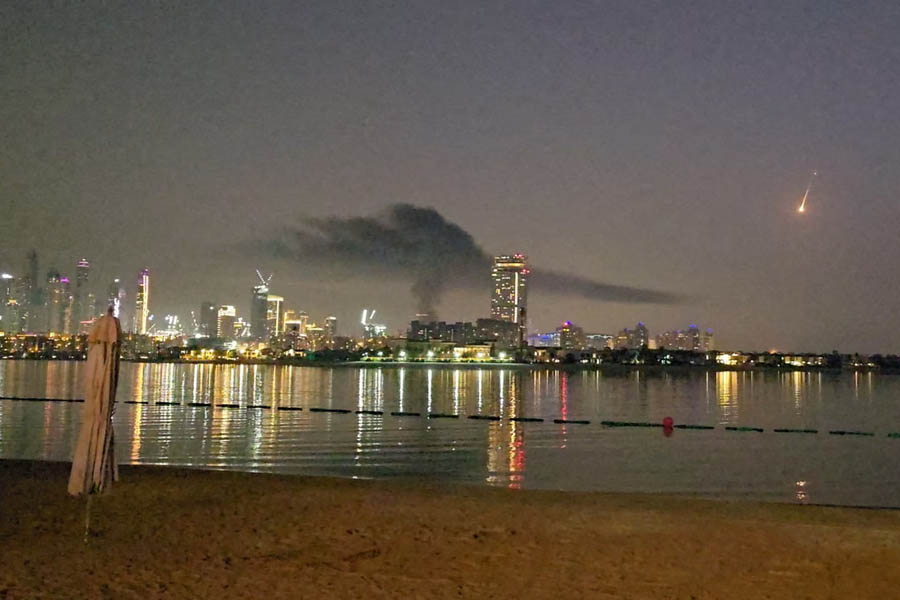 Smoke rises over a hotel damaged in Dubai's famed Palm Jumeirah, on 28 February, as the Iran war continues to impact the region.