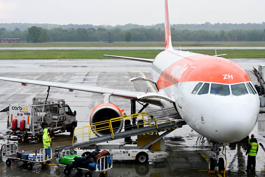 An easyJet aircraft stands on the tarmac as the airline warns that soaring fuel costs from the Iran war have added £25m in expenses in a single month.