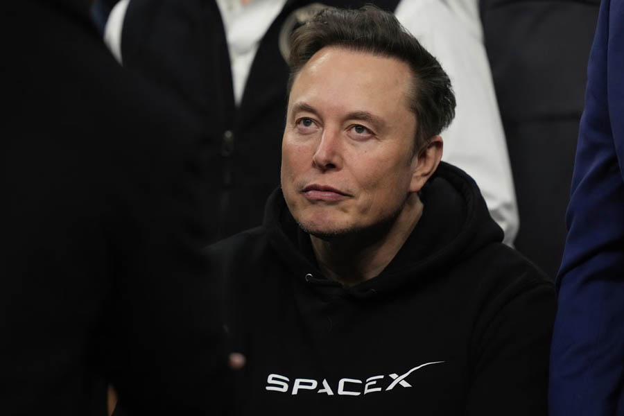 Elon Musk, founder and CEO of SpaceX, stands in front of a Starship rocket. With SpaceX's $1.77 trillion IPO, Musk could become the world's first trillionaire.