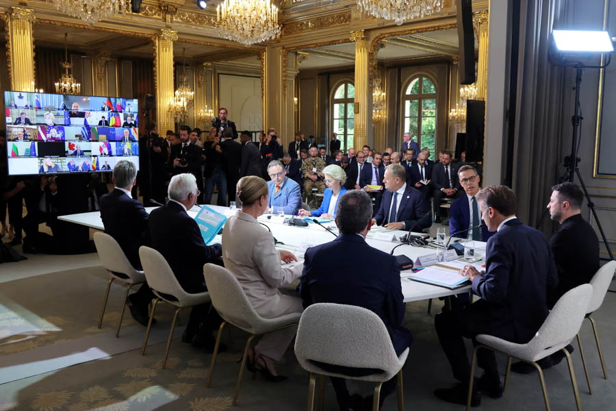 French President Emmanuel Macron hosting a video call summit at Élysée Palace, Paris, focusing on Ukraine military support.