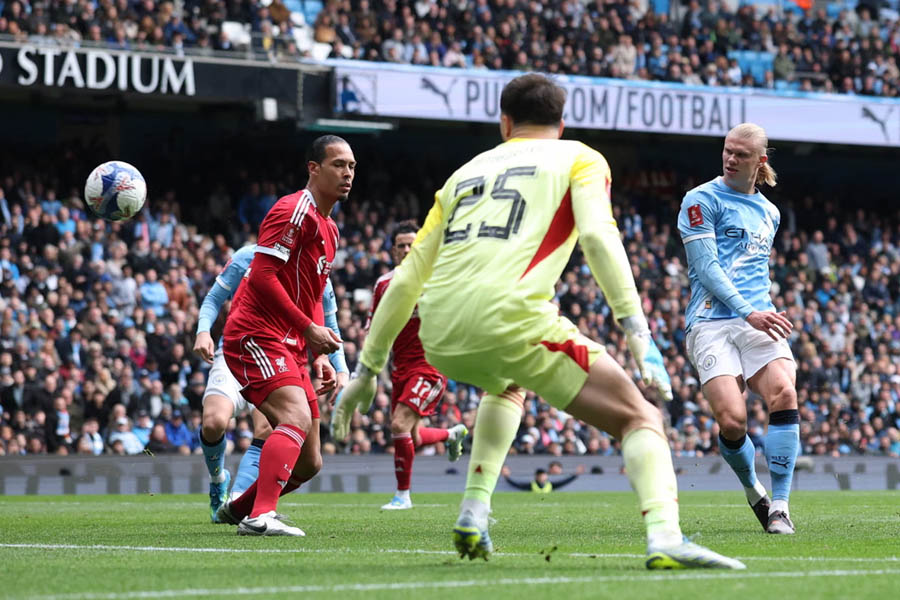 Erling Haaland scores Manchester City's fourth goal to complete his hat-trick as City cruise past Liverpool 4-0 to reach the FA Cup semi-finals.
