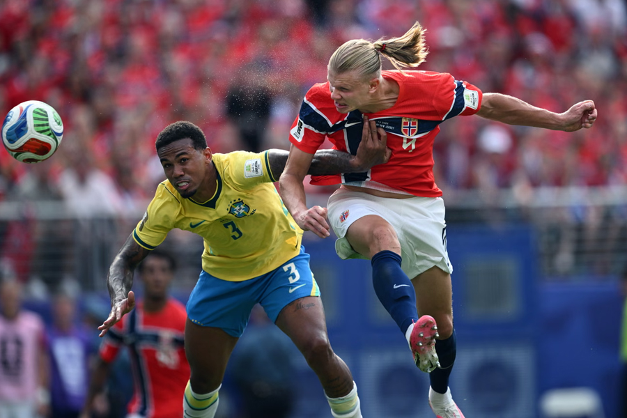 Erling Haaland of Norway scores with a bullet header against Brazil
