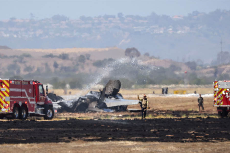 Fire crews spray down the wreckage of an F-35B fighter jet after it crashed near Miramar air base in San Diego. The pilot ejected safely and is being treated for non-life-threatening injuries.