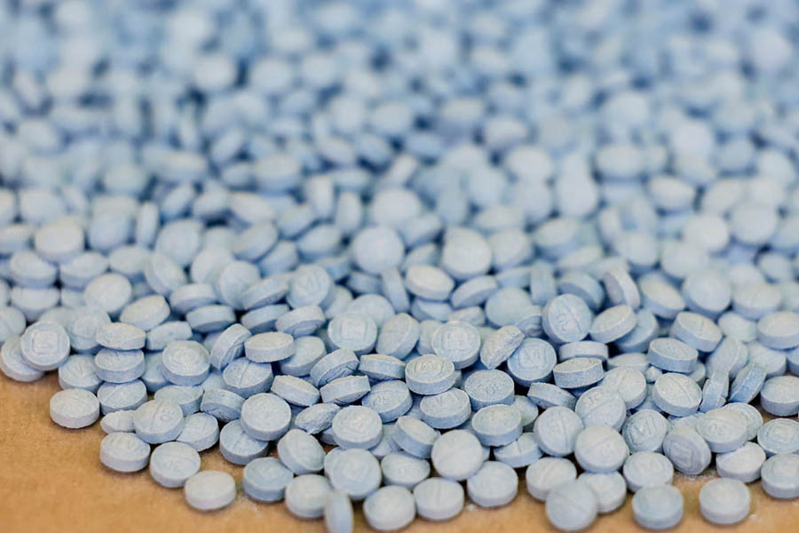 Fentanyl pills and opioid crisis illustration