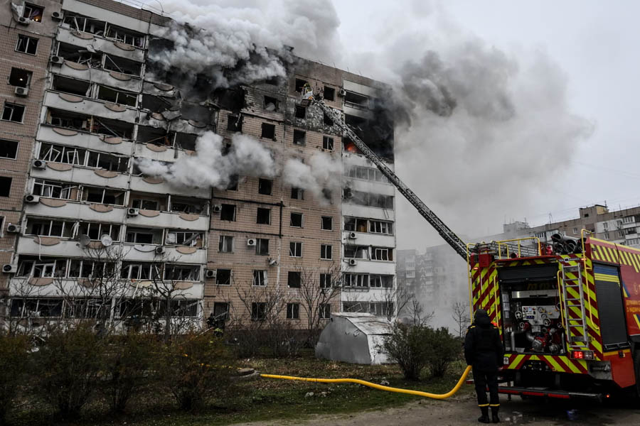 Firefighters battling a fire in a damaged apartment building after a Russian guided aerial bomb attack in Zaporizhzhia, southern Ukraine