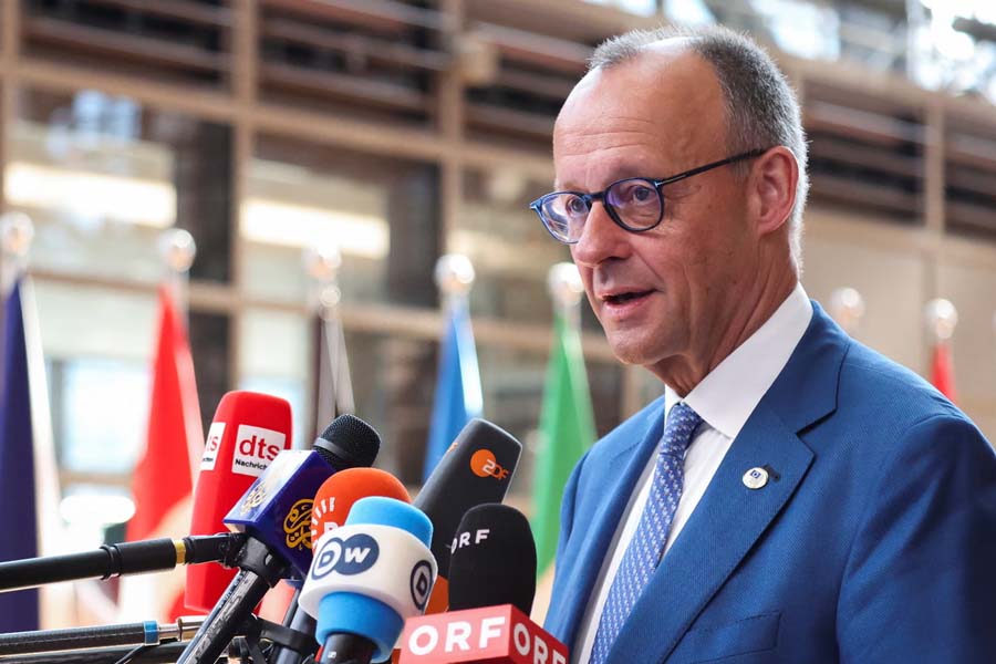 German Chancellor Friedrich Merz speaks to the press at the European Union leaders' summit in Brussels, Belgium