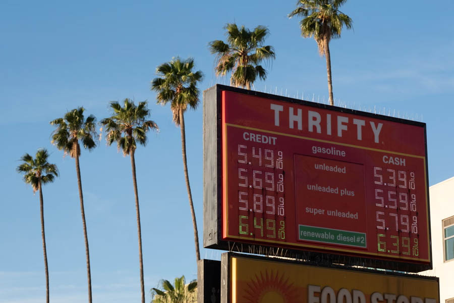 Gas station price board showing fuel costs in Los Angeles on March 13, 2026 amid global oil market uncertainty and Middle East tensions.