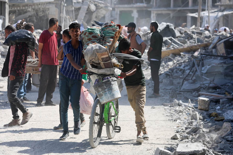 Gaza residents walking through their neighborhoods for the first time in six months to inspect homes and streets after a ceasefire halts fighting in the territory.