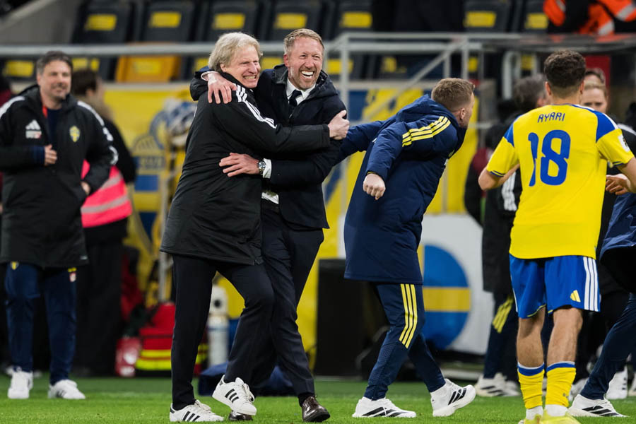 Graham Potter celebrates passionately on the touchline after guiding Sweden to World Cup qualification, marking a historic achievement in his managerial career.
