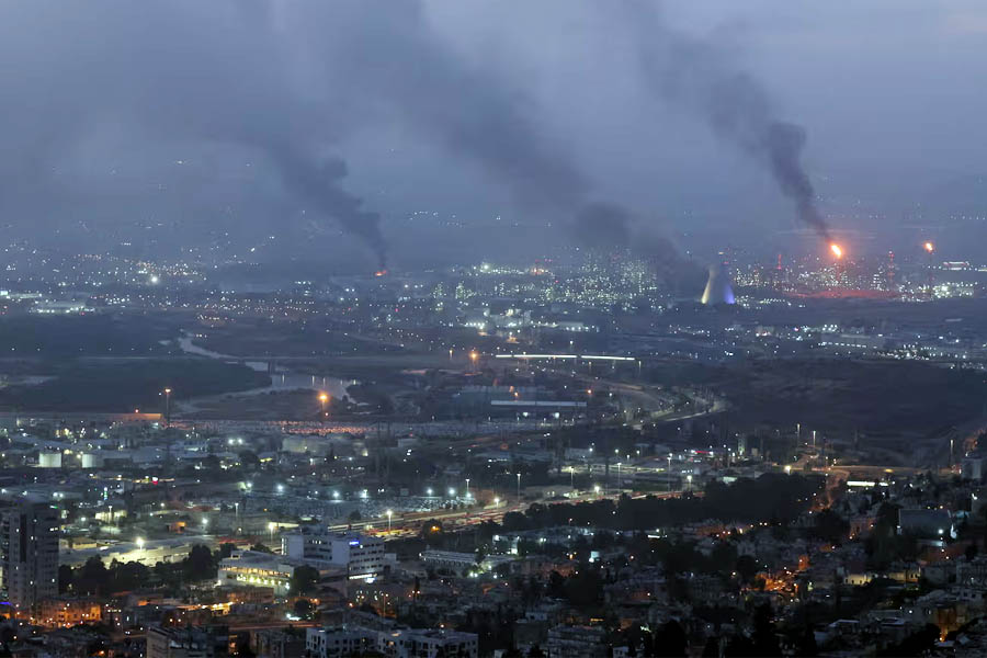 Smoke billows from a site in the city of Haifa on June 16, 2025, following a fresh barrage of Iranian missiles