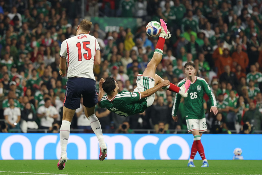 Harry Kane clips Brian Gutierrez in the box for Mexico's penalty