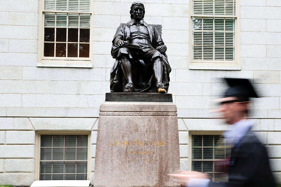 John Harvard statue on commencement day in Cambridge, Massachusetts