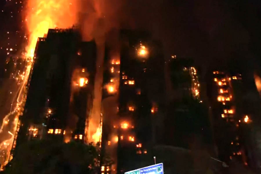Residents trapped inside a Hong Kong high-rise as flames spread across the building.