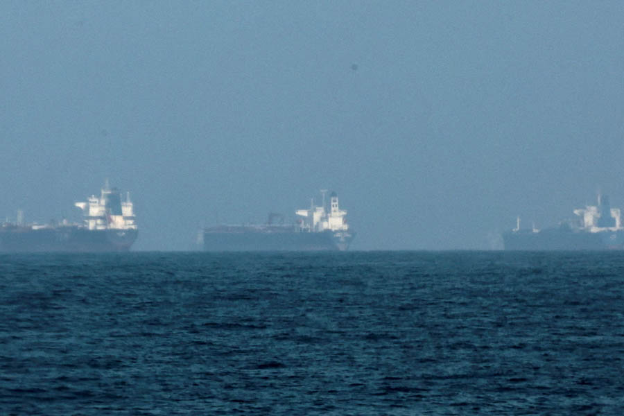 Oil tankers waiting near Fujairah coast in the United Arab Emirates during the Strait of Hormuz crisis after Donald Trump announced a $20 billion reinsurance scheme to revive global oil shipping.