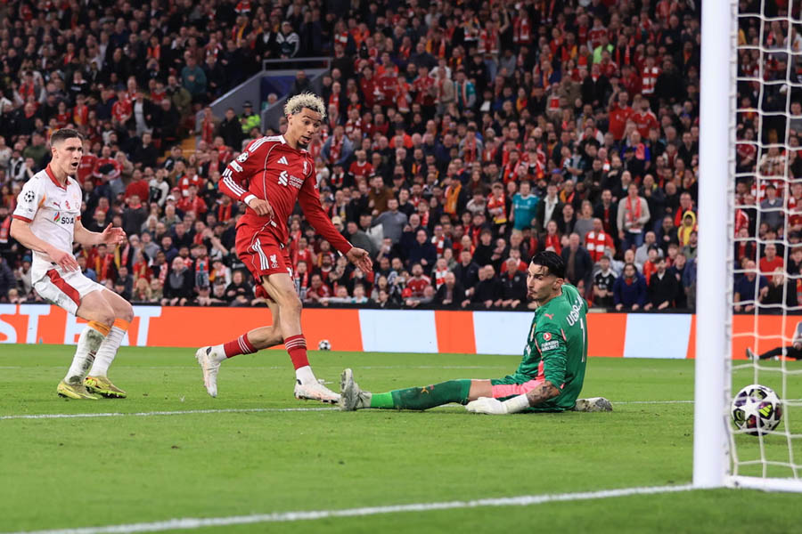 Hugo Ekitiké scoring goal for Liverpool against Galatasaray in Champions League match, extending lead with shot inside penalty area at Anfield