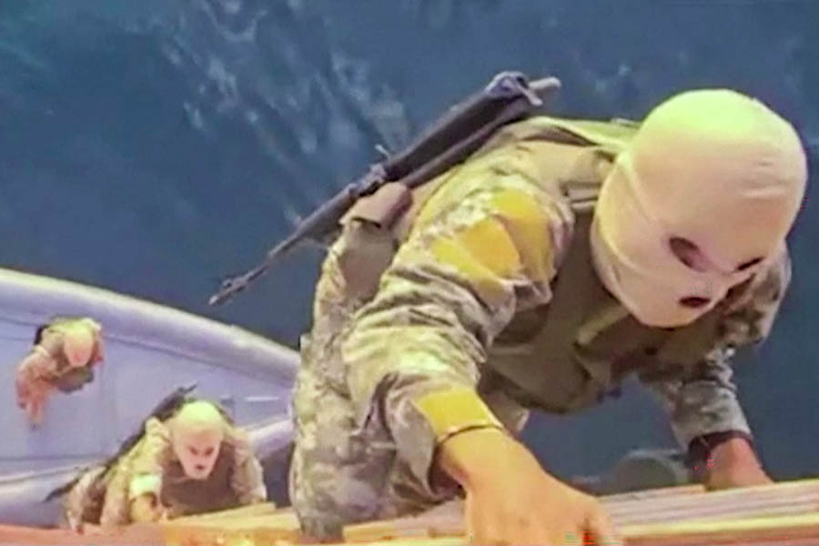 A screen grab taken from undated video footage released by Iran's Revolutionary Guards (IRGC) allegedly showing its naval forces boarding a ship attempting to cross the strait of Hormuz.