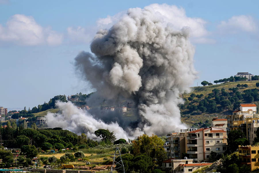 Thick plumes of smoke billow from buildings after an Israeli airstrike in the southern Lebanese village of Nabatieh on Monday.