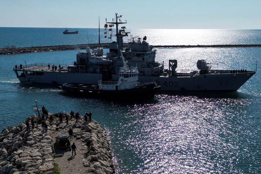 A drone view shows the Italian navy ship Libra, carrying migrants as part of a deal with Italy to process asylum-seekers caught near Italian waters, as it arrives in Shengjin, Albania