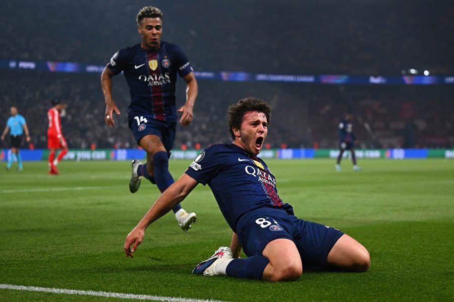 João Neves slides in delight after scoring PSG's second goal of the night during their breathtaking 5-4 Champions League semi-final first leg victory over Bayern Munich.