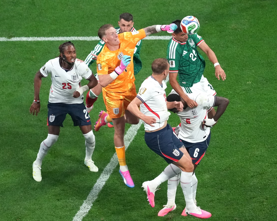 Jordan Pickford punches clear for England against Mexico